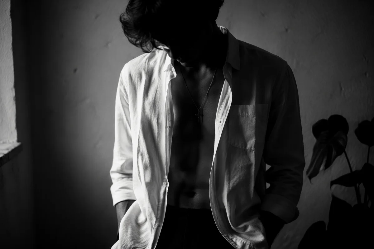 Cross Necklace in Quiet Indoor Portrait