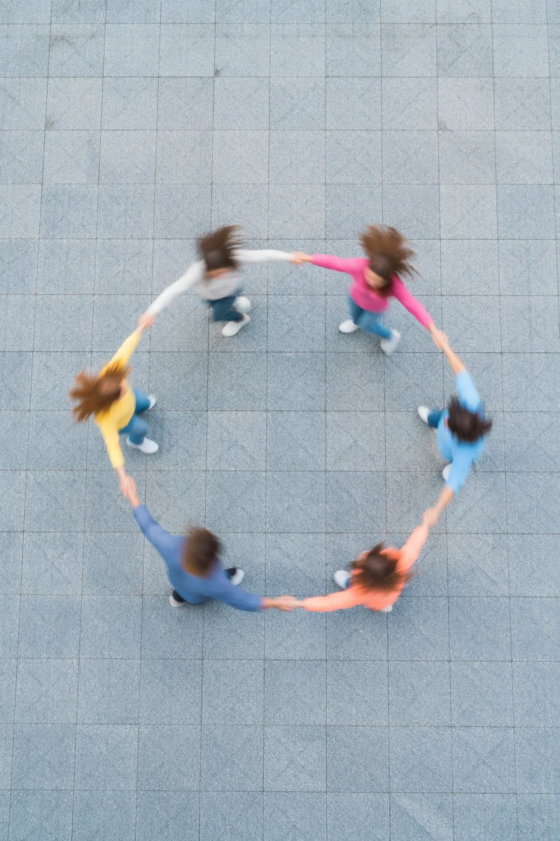 Overhead Friends Group Hug in Colorful Motion