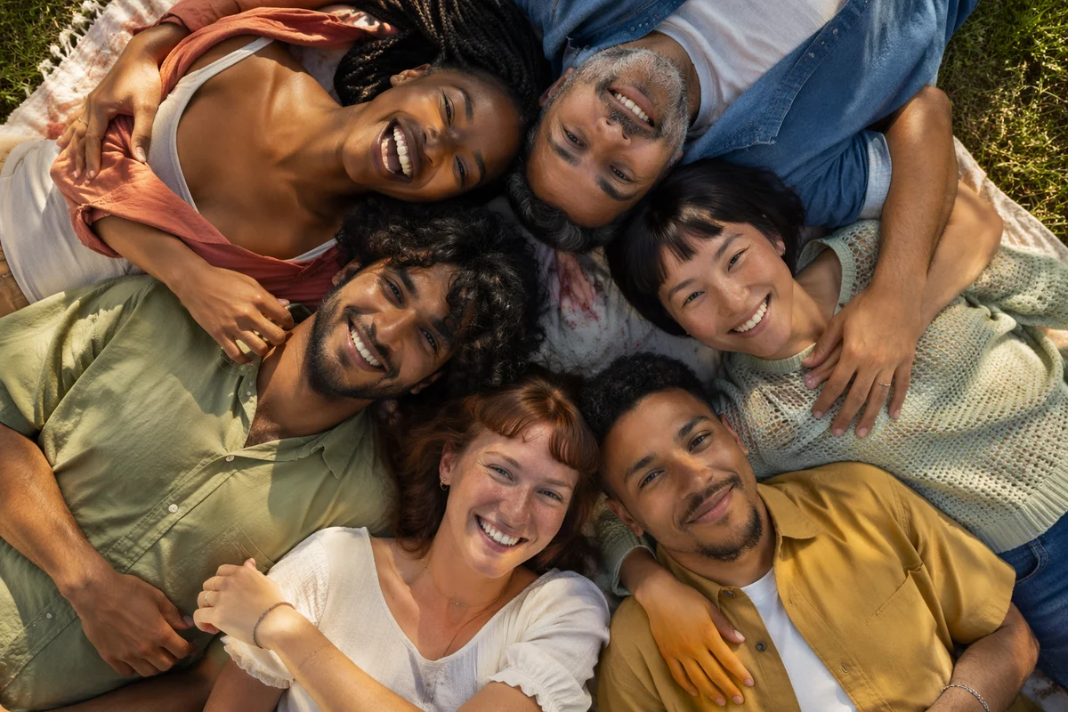 Six Friends Hug Circle in Park