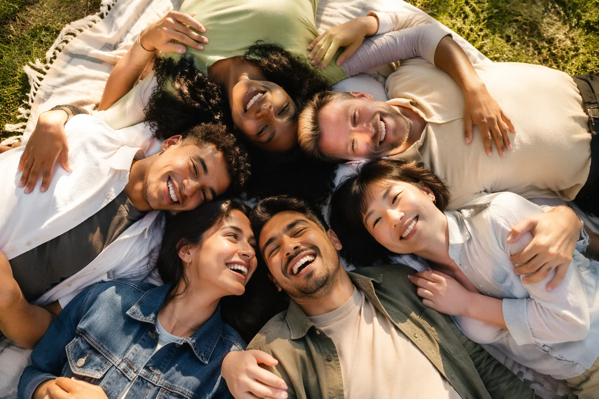 Six Friends Hugging on Picnic Blanket