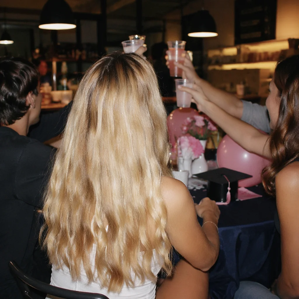 Friends Celebrating at Cozy Graduation Party