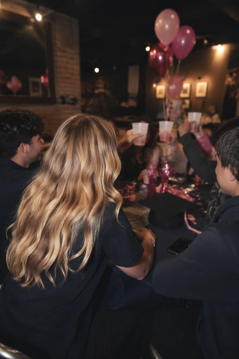 Friends Celebrating at Cozy Graduation Party