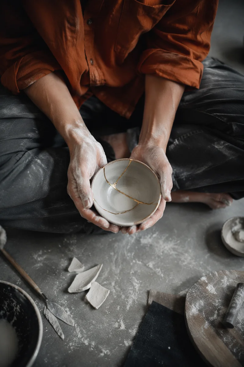 Hands Holding Kintsugi Bowl of Restoration