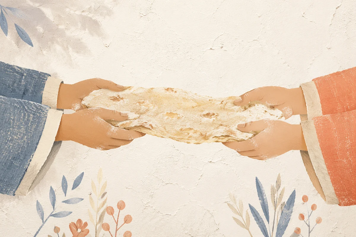 Hands Sharing Rustic Bread in Warm Light