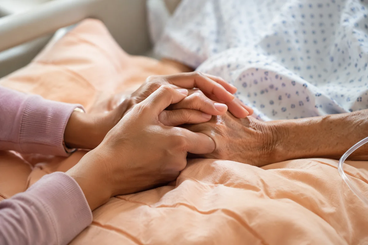 Hospital Bedside Prayer and Comforting Hands