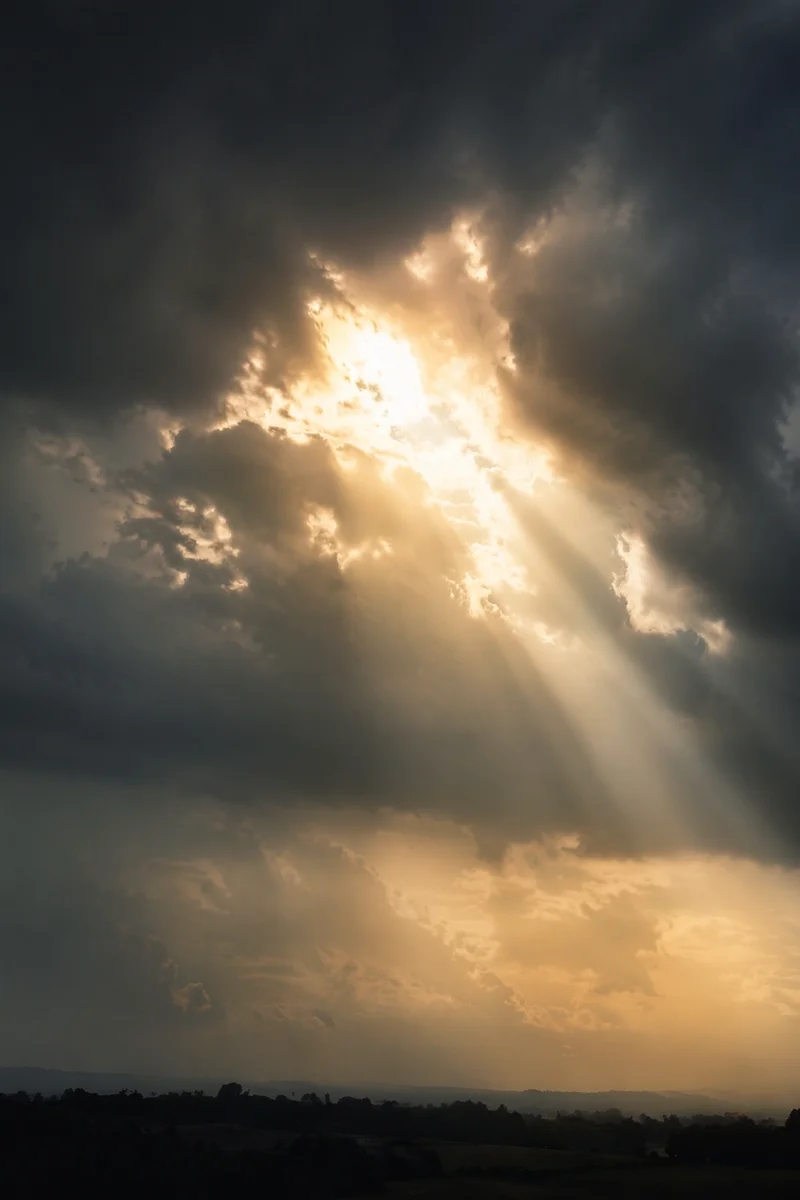 Sunlight Breaking Through Storm Clouds