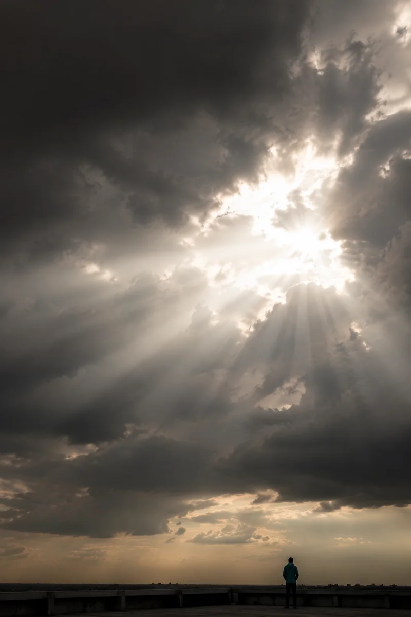 Sunlight Breaking Through Storm Clouds of Hope