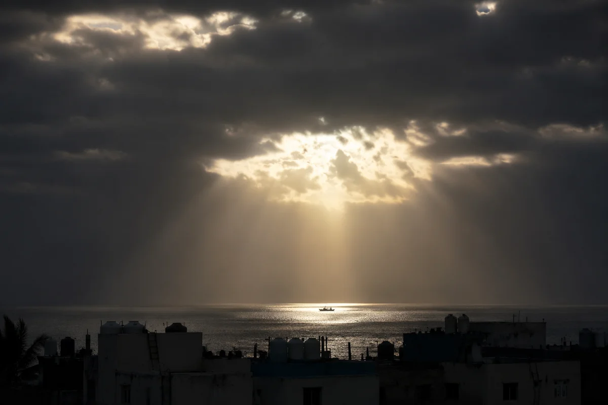 Hopeful Sunlight Breaking Through Storm Clouds