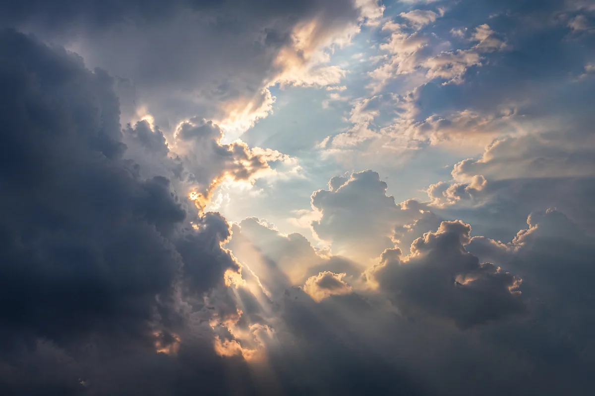 Golden Light Breaking Through Storm Clouds