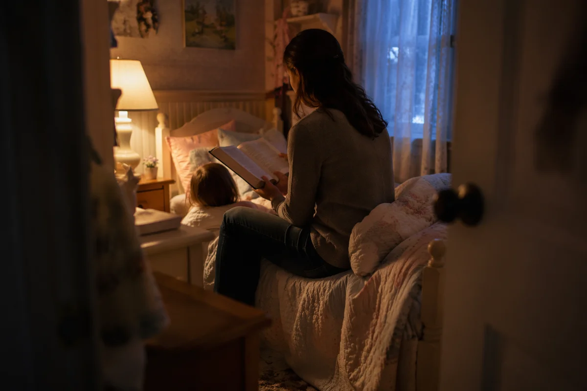 Parent Reading Bible to Child at Bedtime