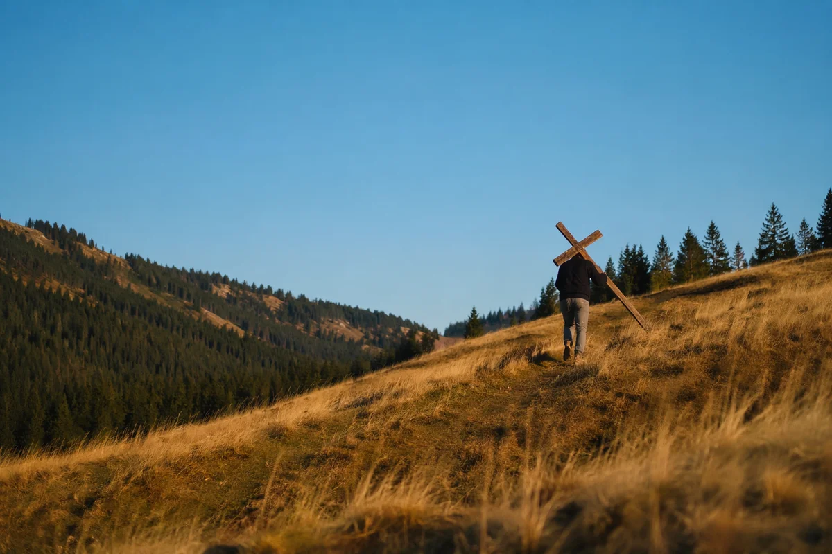 Solitary Cross Bearer on Golden Hillside