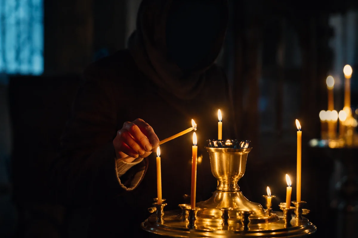 Candle Lighting Prayer in a Dark Chapel