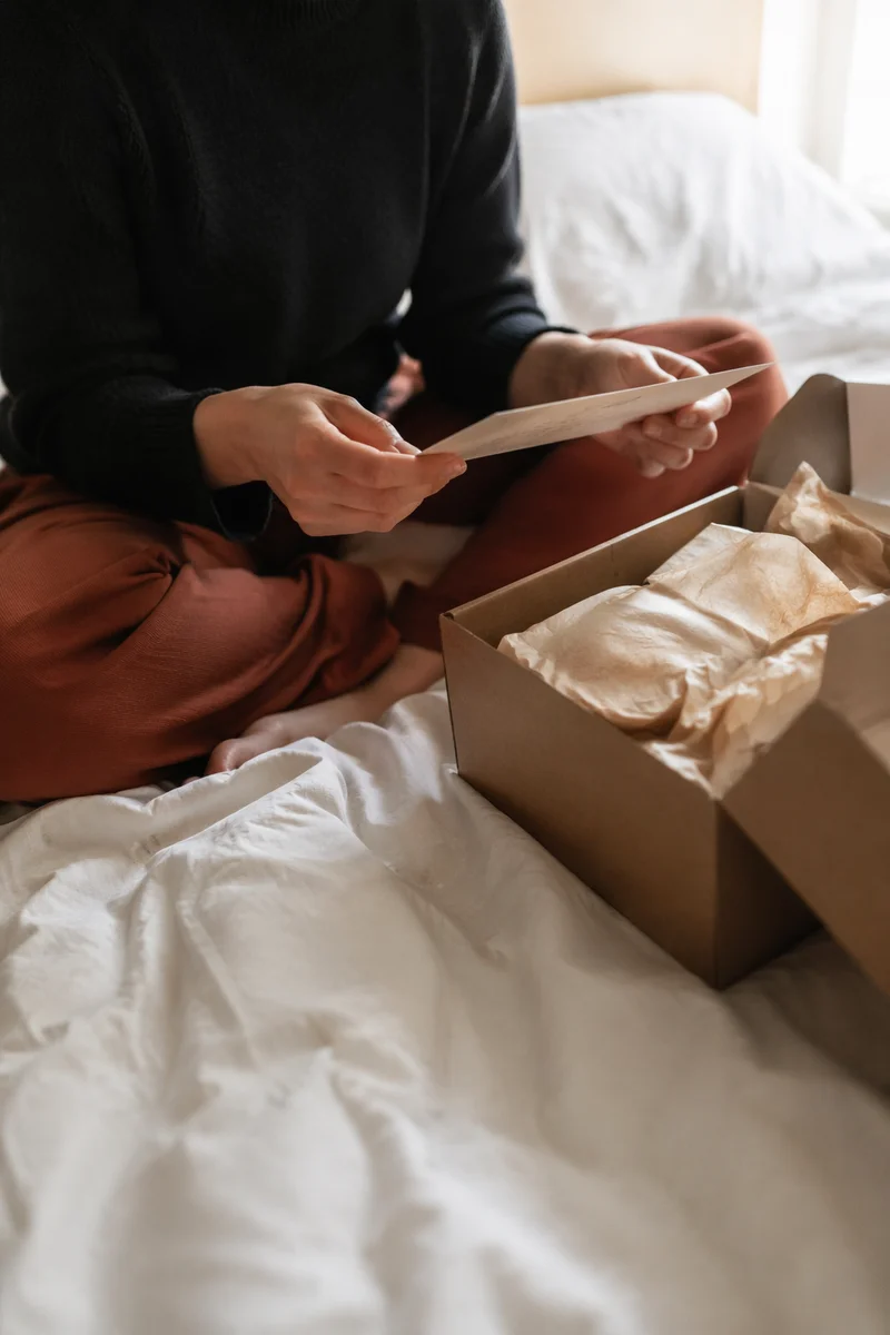 Joyful Gift Box Moment in Cozy Bedroom