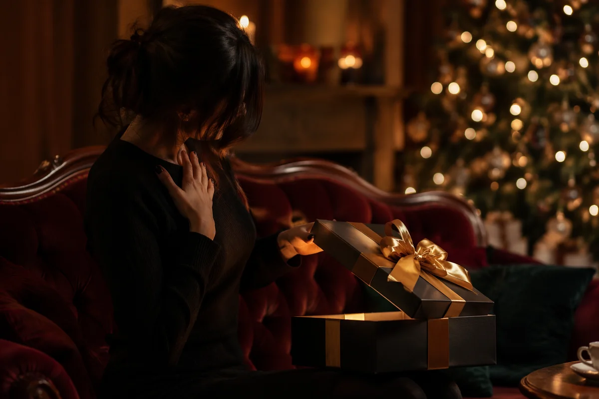 Joyful Gift Opening in Warm Festive Room