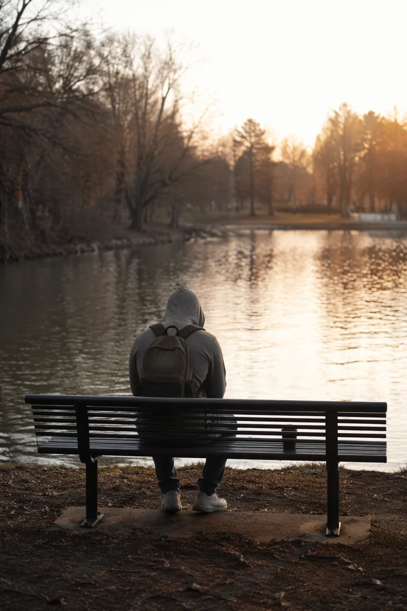 Solitary Park Bench Reflection by Winter Lake