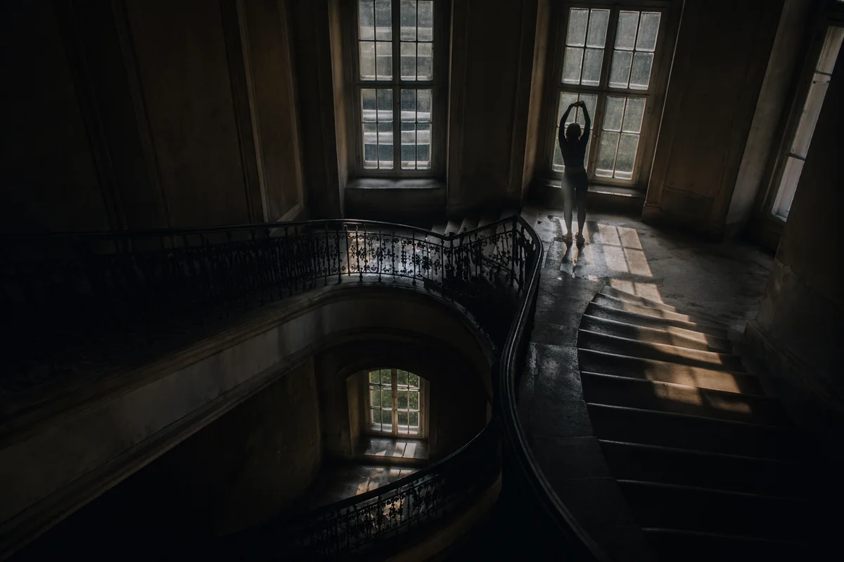 Morning Stretch Silhouette in Stairwell Light