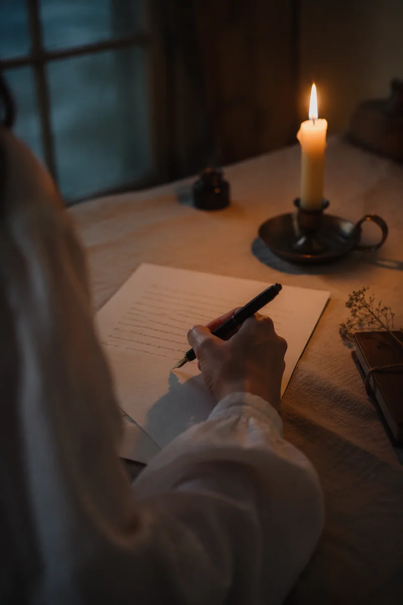 Handwritten Letter by Warm Candlelight