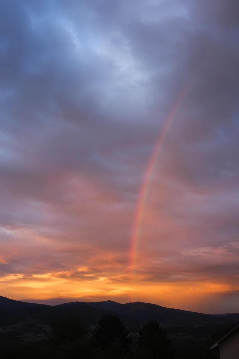 Peaceful Sunrise Rainbow After Storm