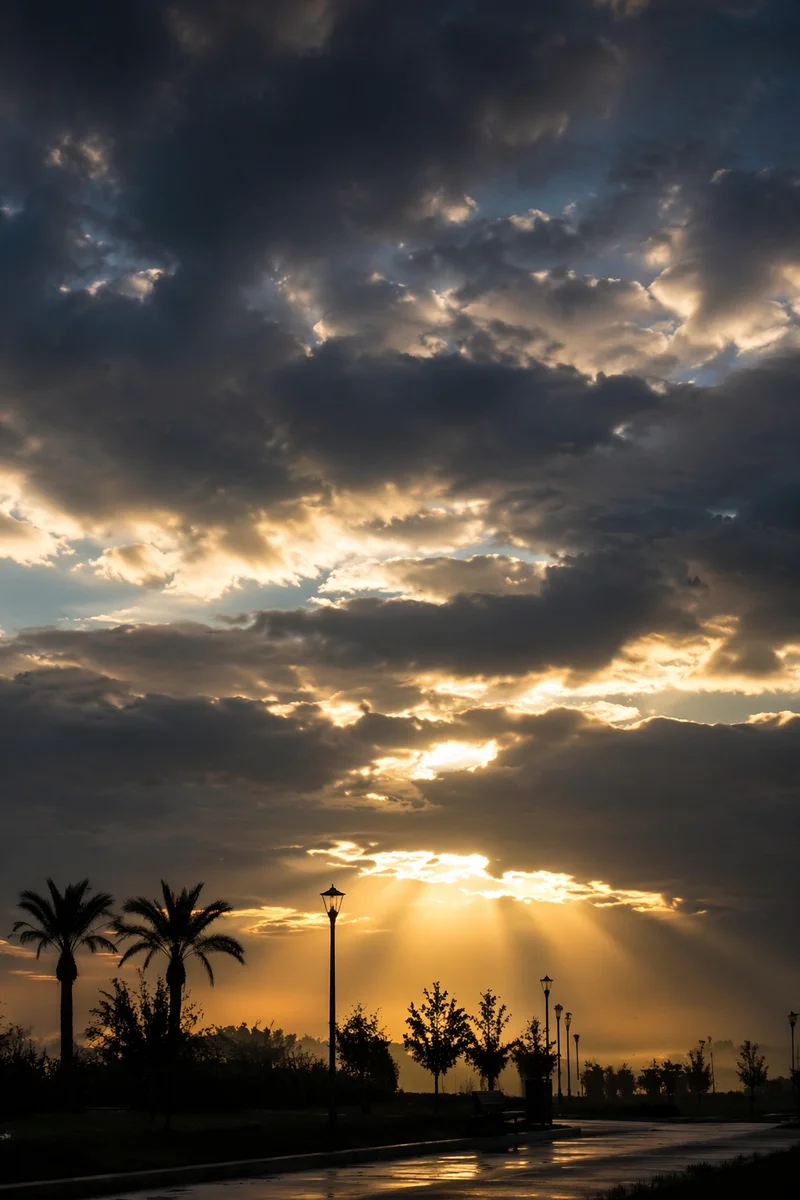 Peaceful Sunrise Breaking Through Storm Clouds