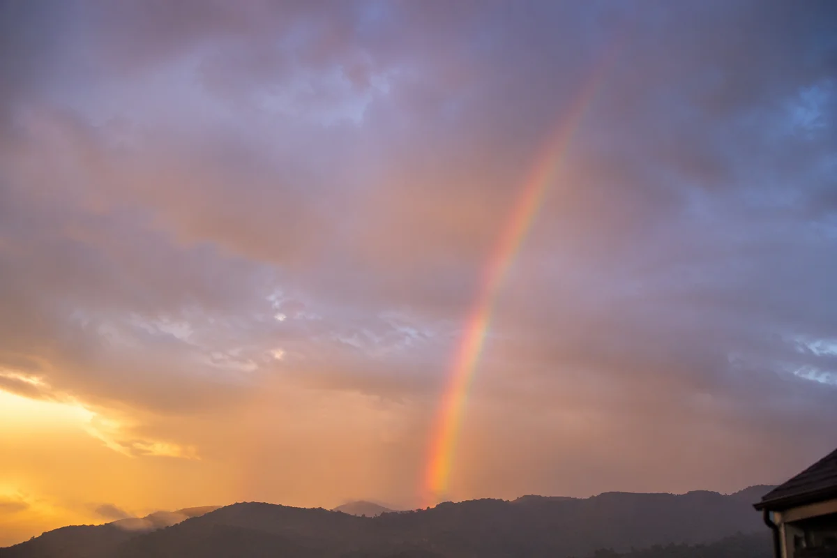 Peaceful Sunrise Rainbow After Storm
