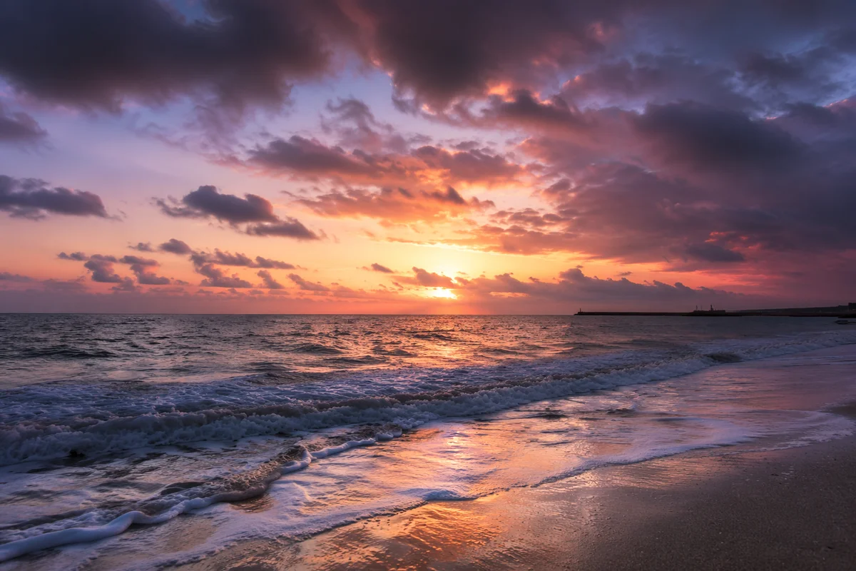 Peaceful Sunrise Over Storm Washed Shore