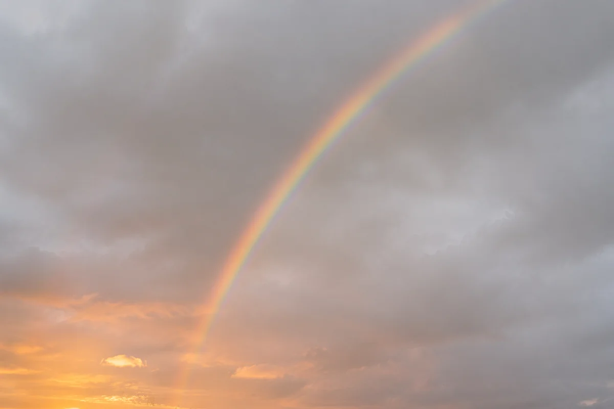 Peaceful Sunrise Rainbow After Storm