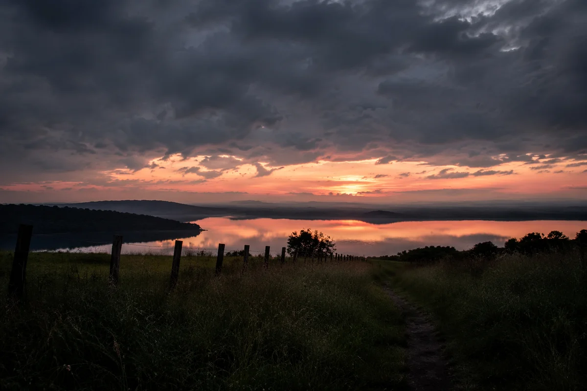 Peaceful Sunrise Over Lake After Storm