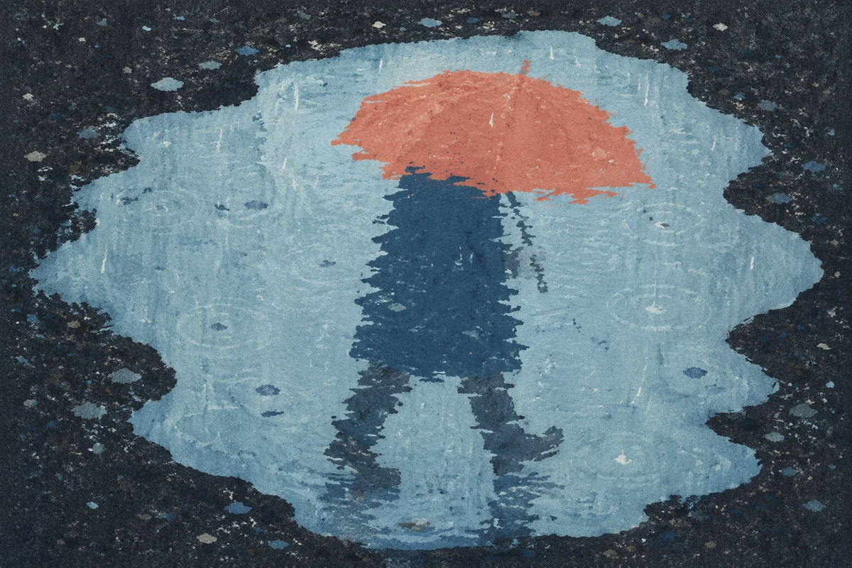 Umbrella Reflection in Rainy Street Puddle