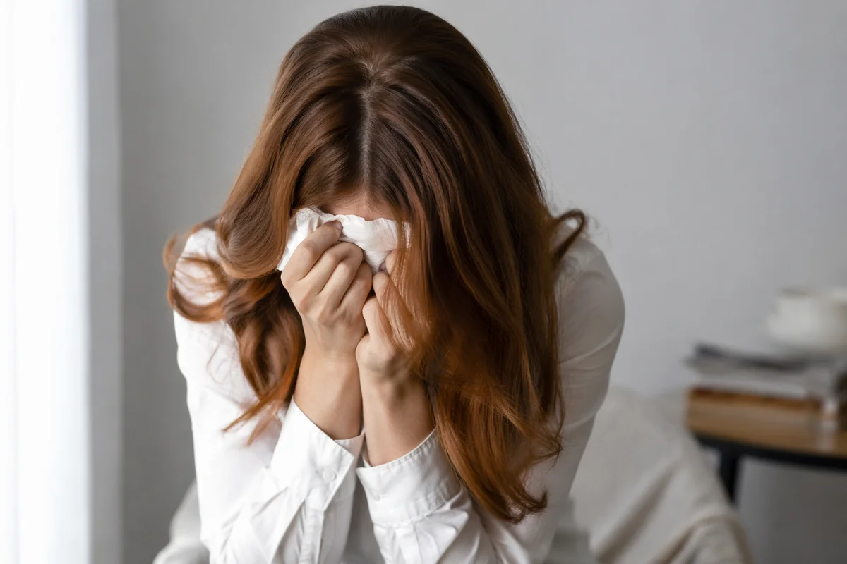 Woman Wiping Tears in Quiet Comfort
