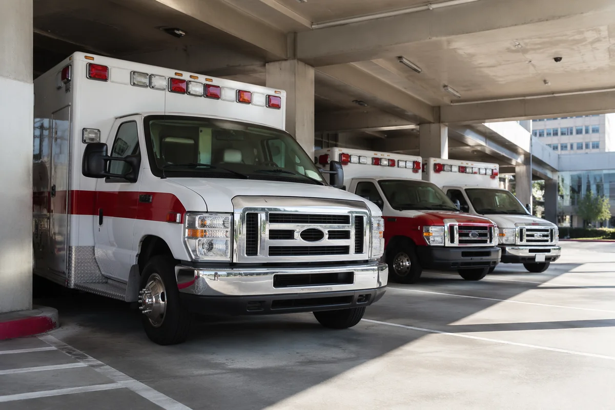 Ambulances Lined Up at Hospital Entrance