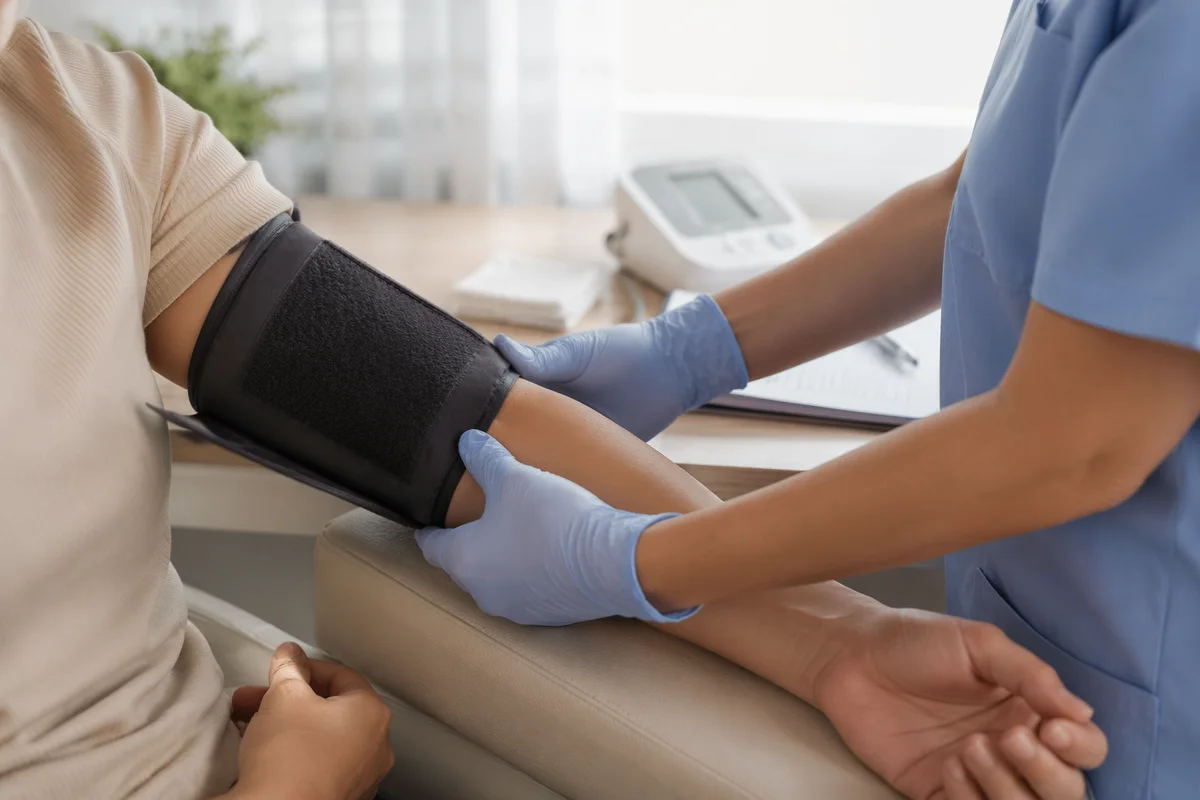 Nurse Checking Patient Blood Pressure Calmly