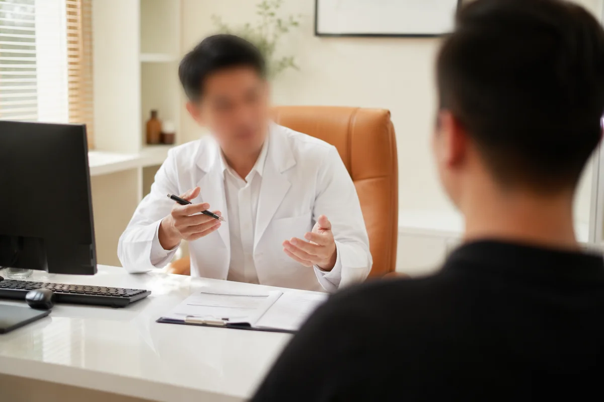 Doctor Consulting Patient in Private Clinic