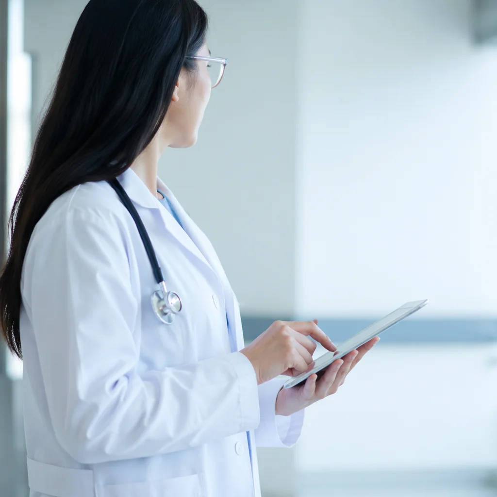 Doctor Using Tablet in Modern Hospital