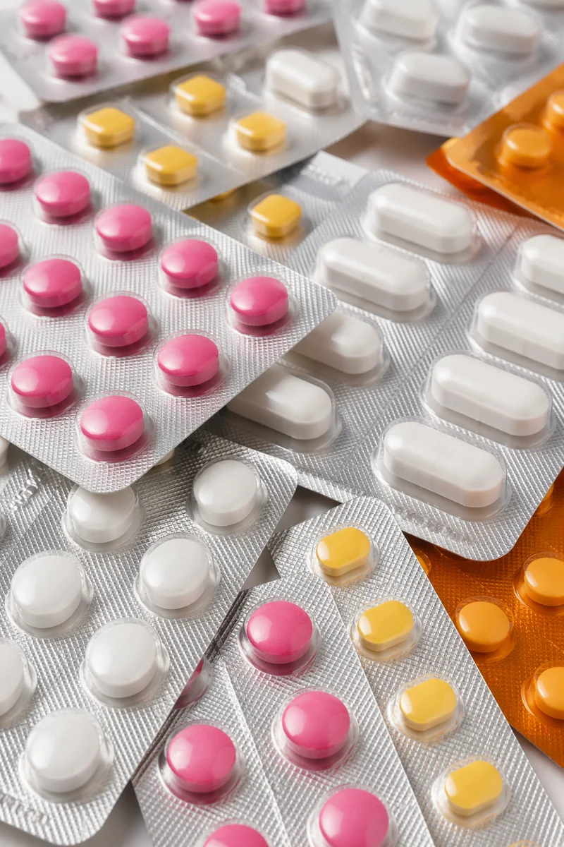 Colorful Medicine Blister Packs on Pharmacy Counter