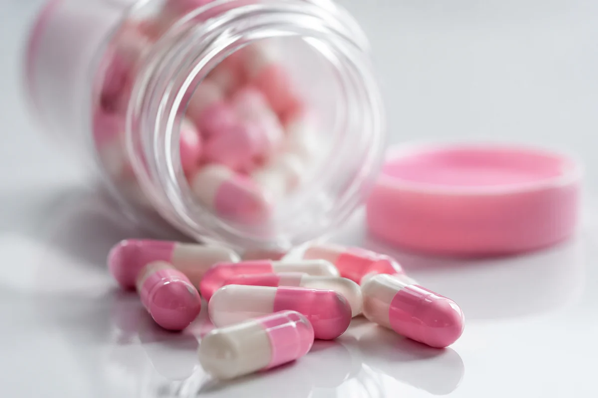 Pink and White Medicine Capsules Closeup