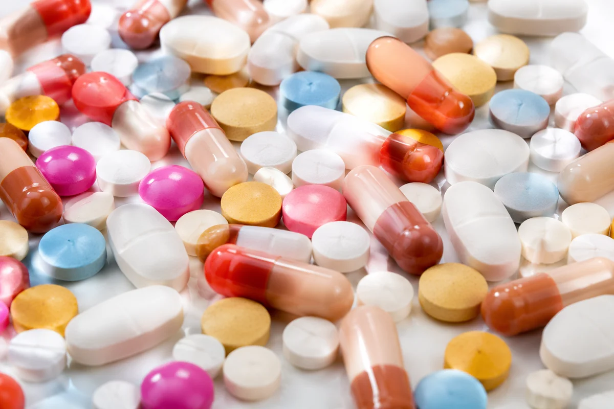 Assorted Medicine Pills on White Counter