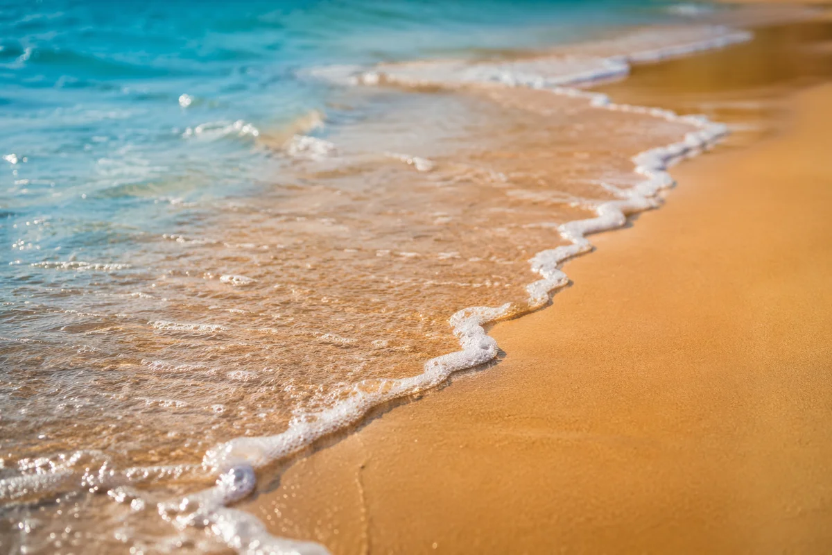 Tropical Shoreline Waves on Golden Sand