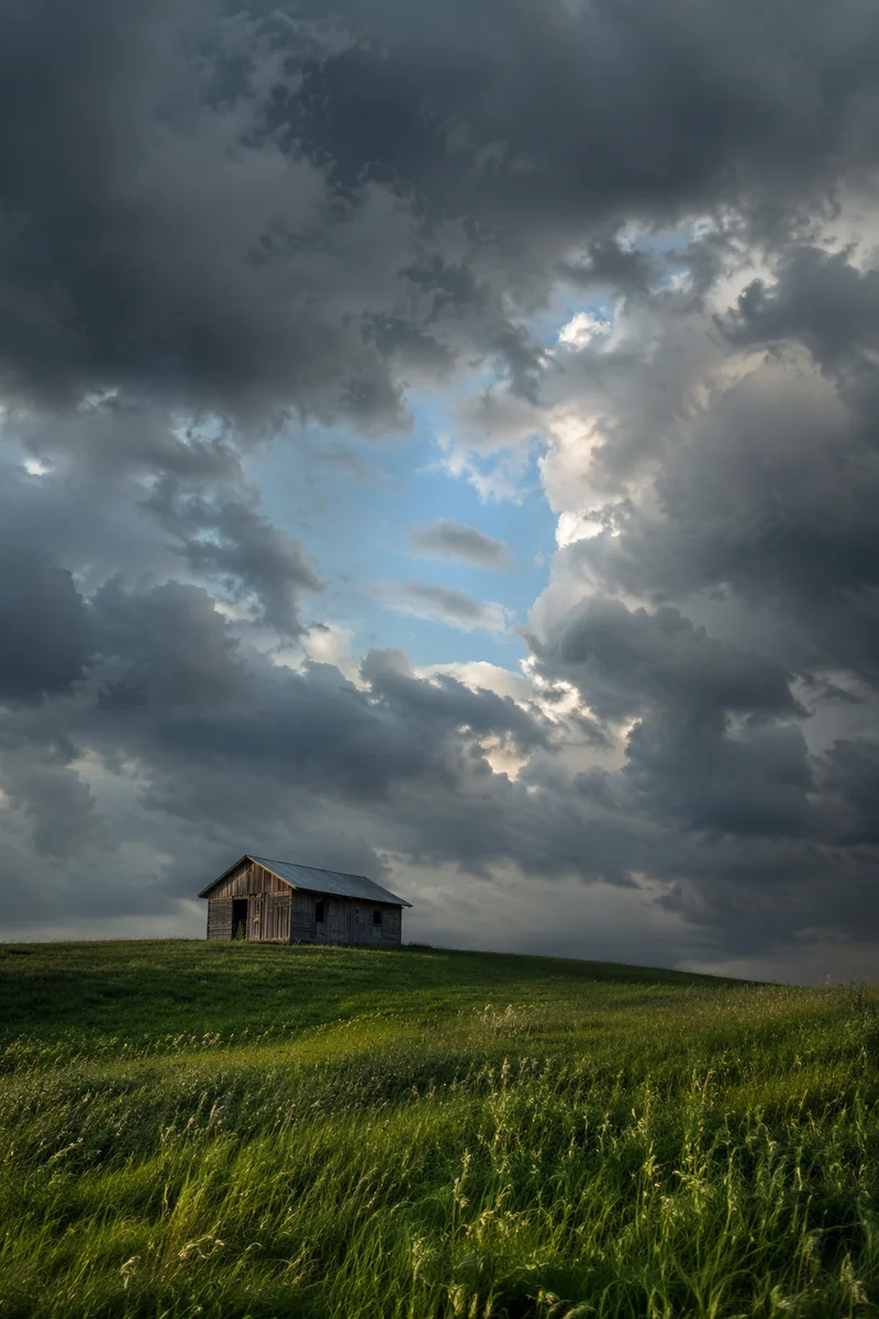 Green Countryside Hill Beneath Storm Clouds