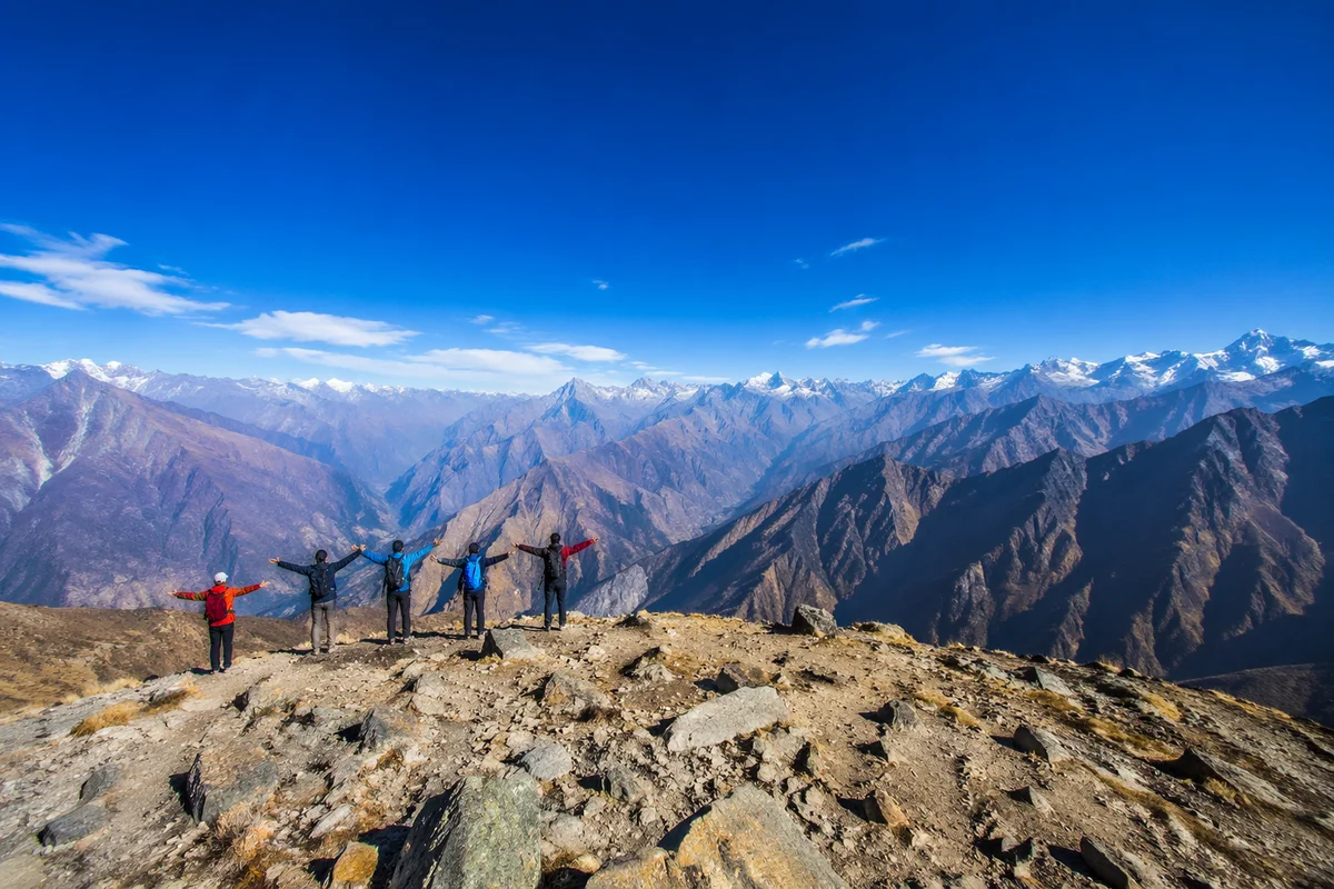 Hikers Celebrating on Alpine Mountain Ridge