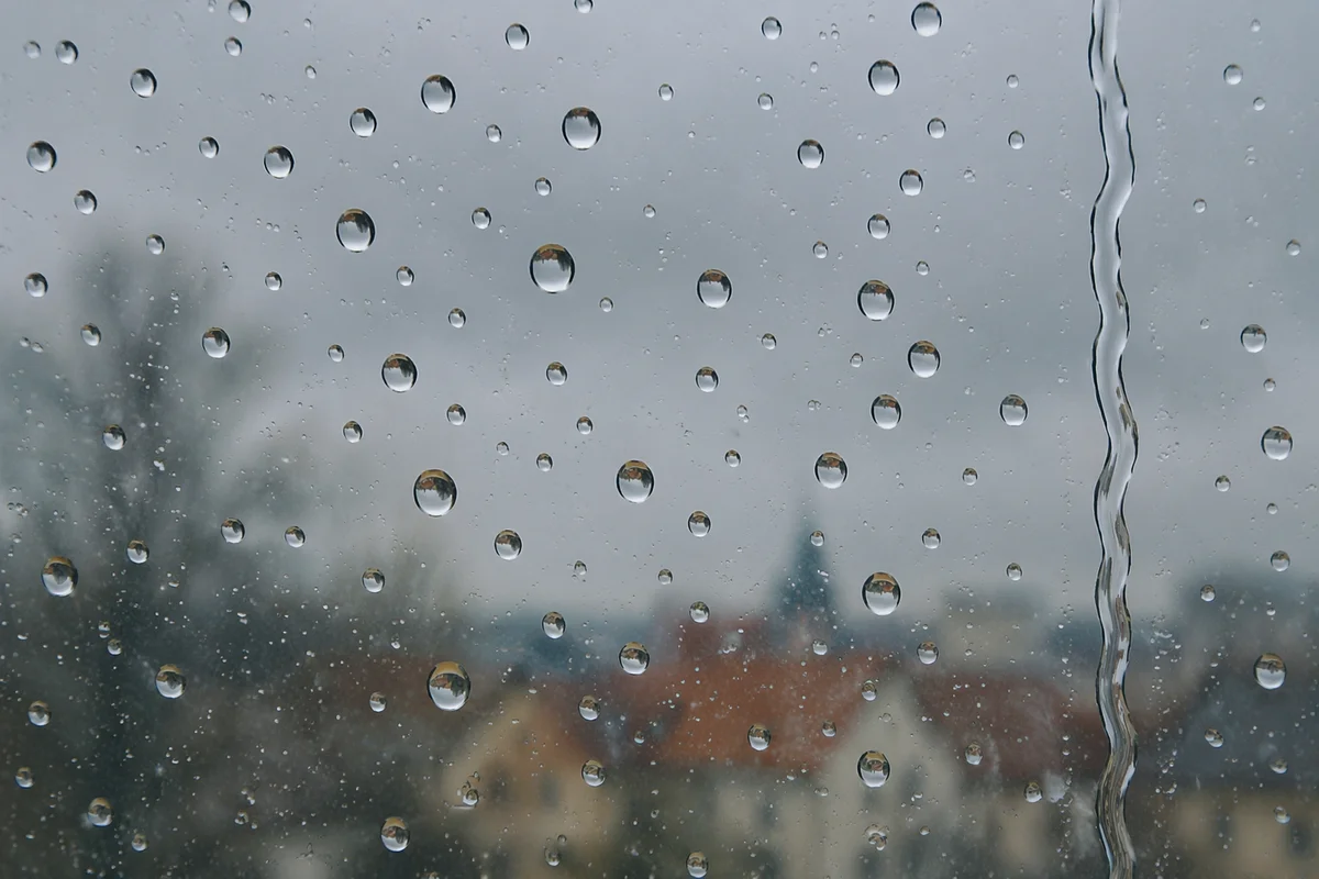 Rain Droplets on Blurred Window Glass