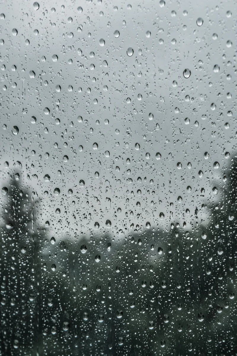 Rain Droplets on Blurred Window Glass