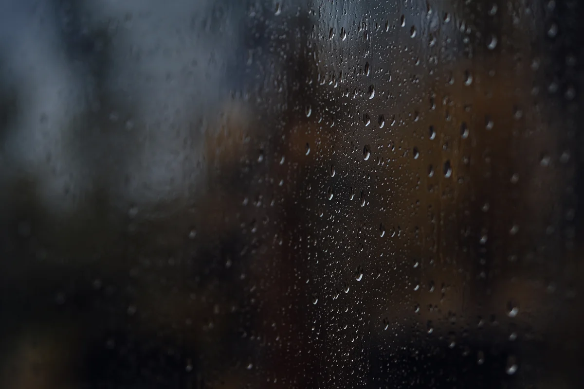 Rain Droplets on Blurred Storm Window