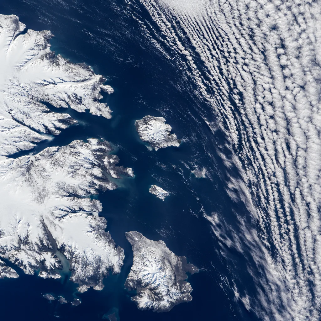 Dramatic Arctic Coastline Beneath Sweeping Clouds