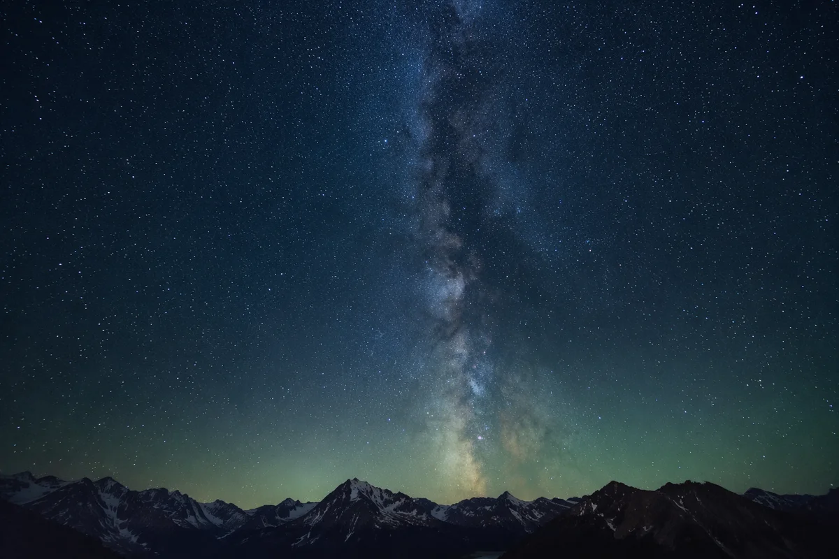 Milky Way Over Dark Mountain Silhouettes
