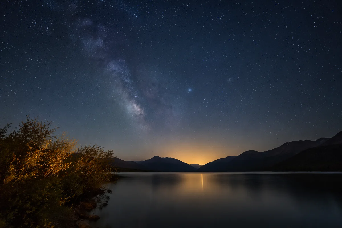Starry Lakeshore Under Dark Blue Night