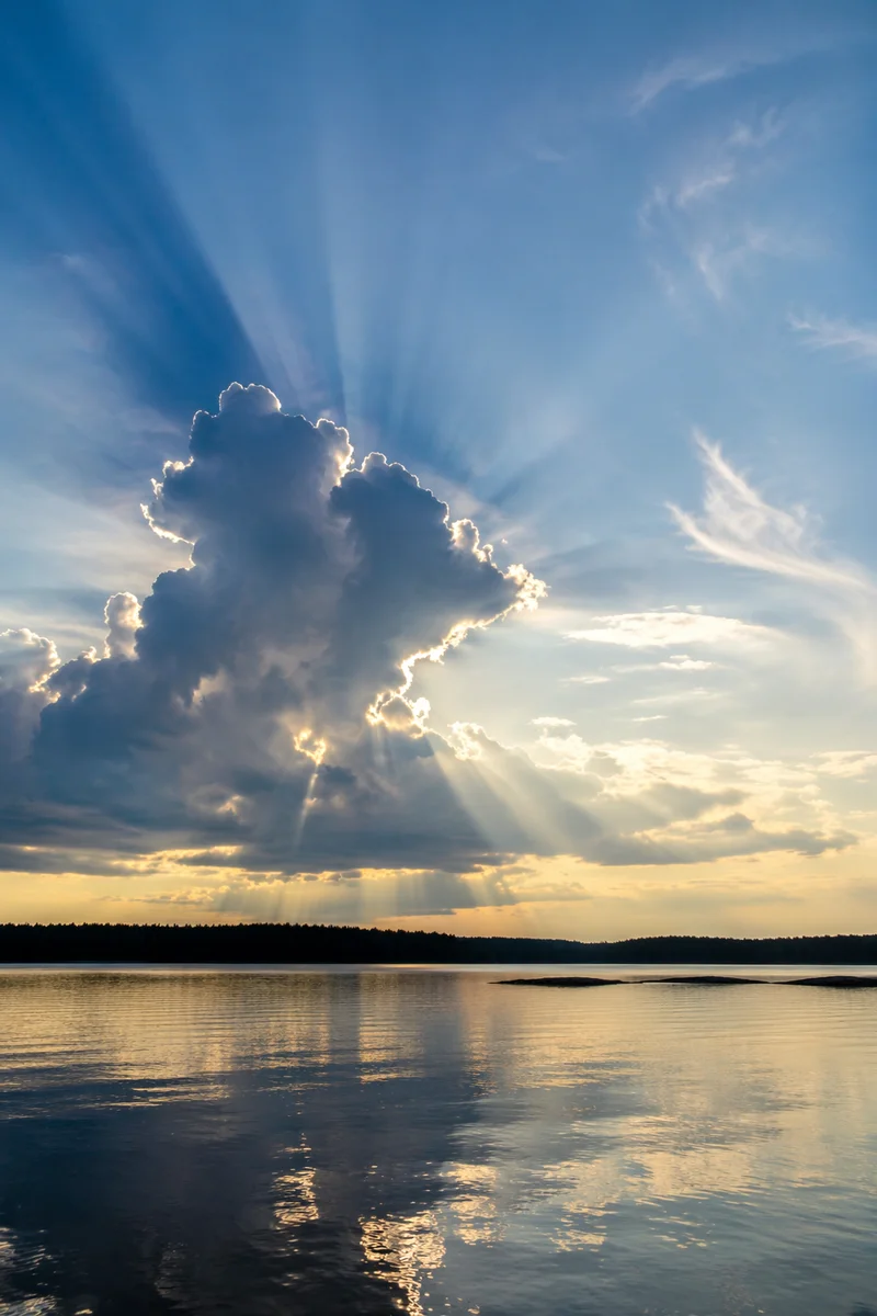 Sun Rays Breaking Through Lakeside Clouds