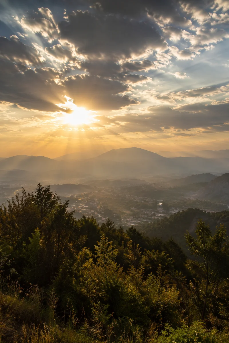 Sun Rays Breaking Through Golden Clouds