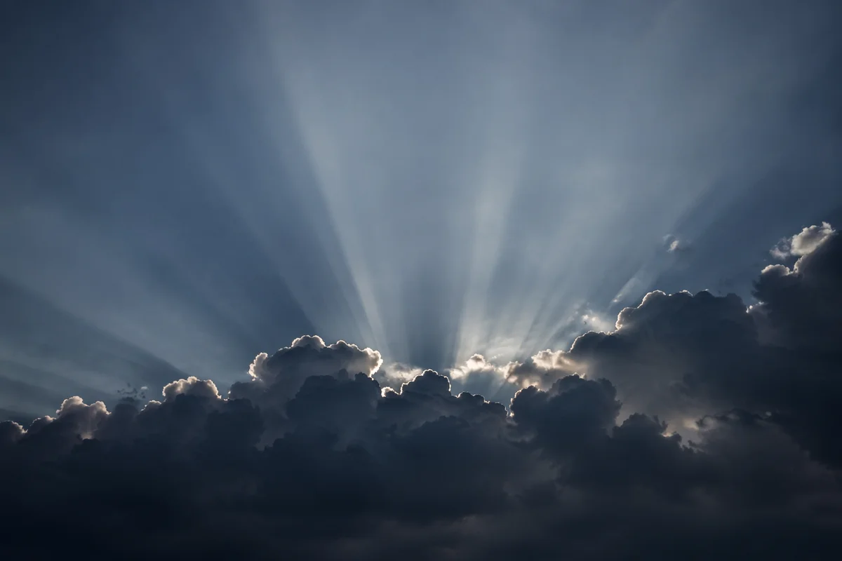 Dramatic Sun Rays Through Storm Clouds