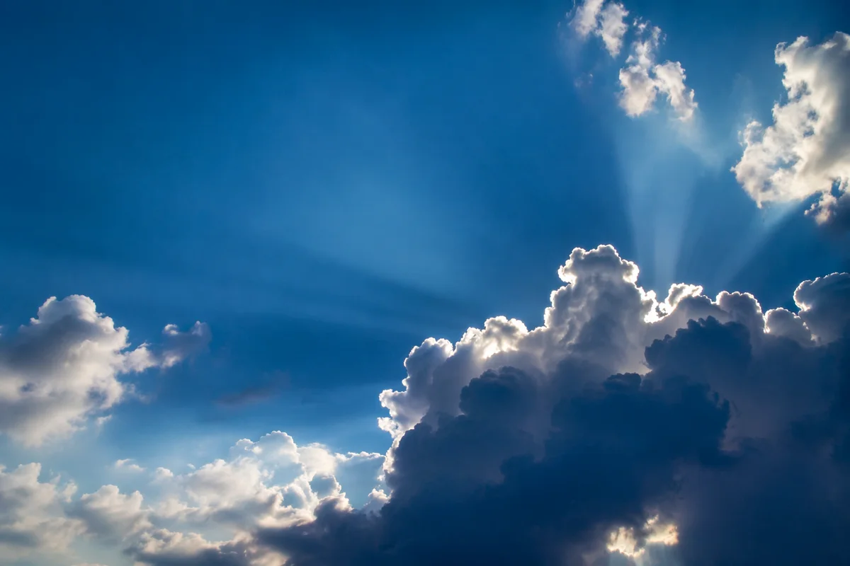 Sun Rays Breaking Through Cumulus Clouds