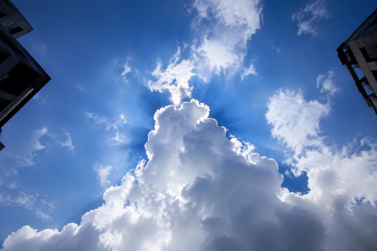 Sun Rays Breaking Through Cumulus Clouds